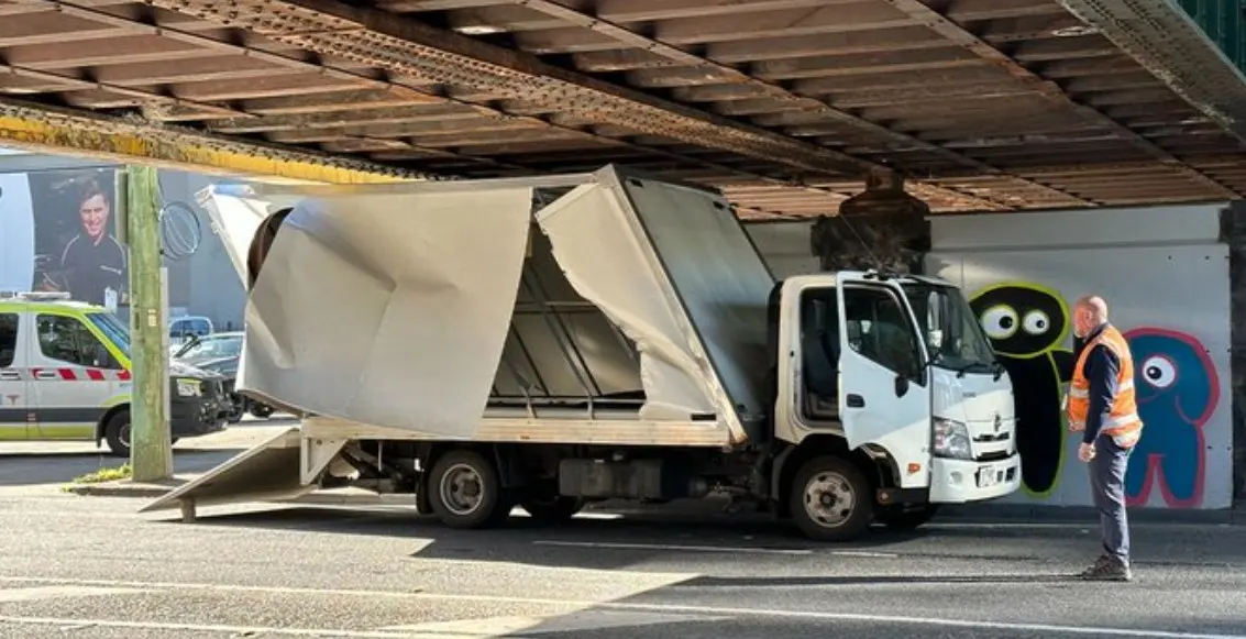 Plain White Tee..Truck being consoled by Yellow and Red outlined Aliens! Believe!
