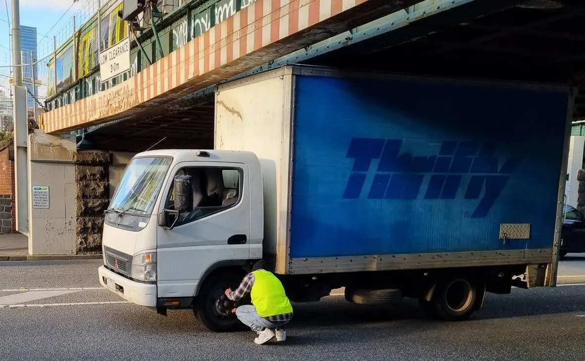 Thrifty Truck Takes on Montague Street Bridge: When Blue Became Bruised!